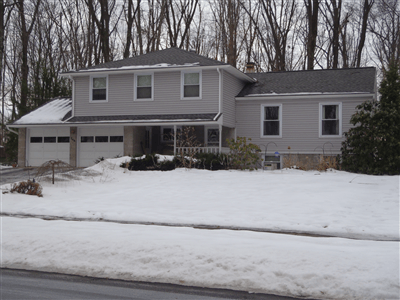 Two story home with newly installed windows in State College, PA