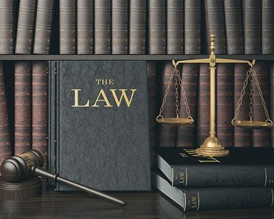 Law Bookshelf with Wooden Judge's Gavel and Golden Scale — South Hill, VA — Harris, Matthews & Crowder, P.C. Law Bookshelf with Wooden Judge's Gavel and Golden Scale — South Hill, VA — Harris, Matthews & Crowder, P.C.