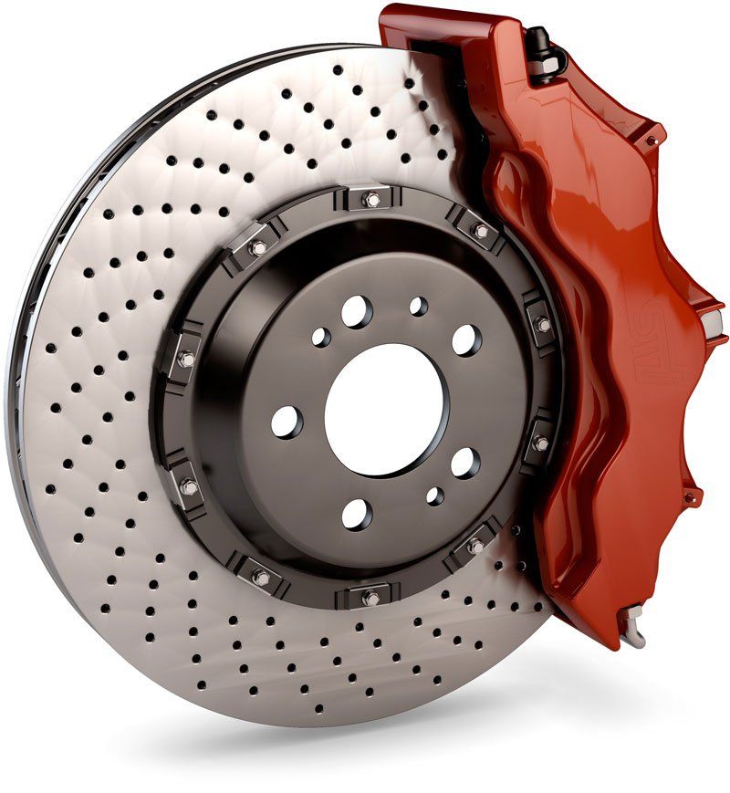 Brake Disc and Red Calliper from a Racing Car isolated on white background