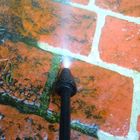 bricks being pressure washed