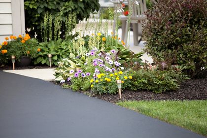 Pretty garden and entryway next to the resin driveway
