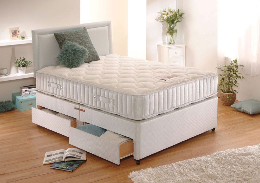Double bed with drawer open in Taylor’s Furniture Stores