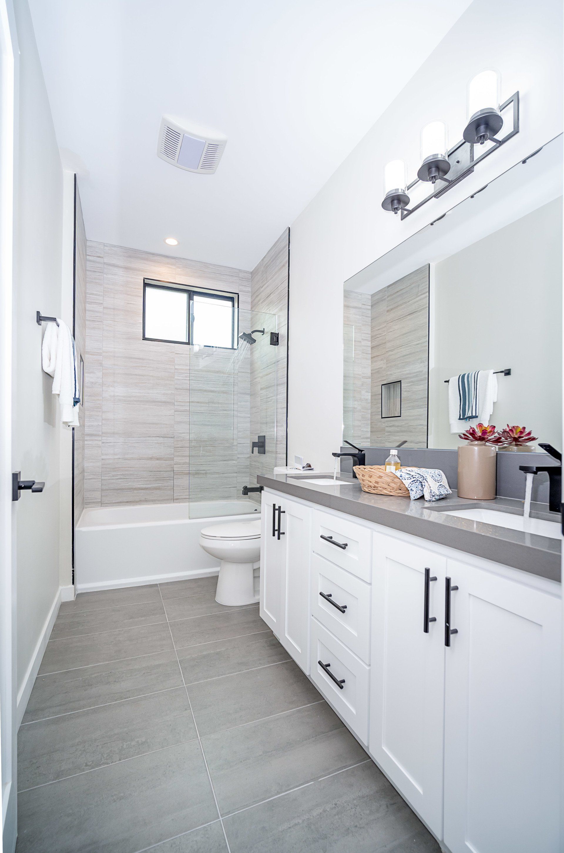 The private, ensuite, full bathroom in the master bedroom of an accessory dwelling unit (ADU) in-law suite.