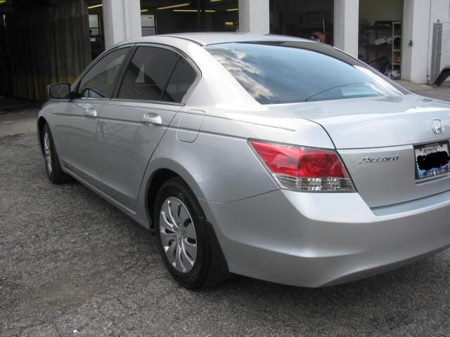 automobile services — side view of a grey car in Louisville, KY