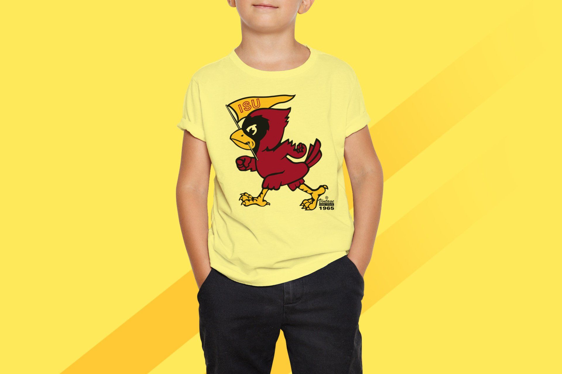 A young boy wearing a yellow t-shirt with a cartoon bird on it.