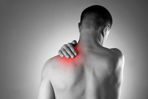 Orthopedic Surgeon —  Man Holding His Shoulder in Lake Success, NY