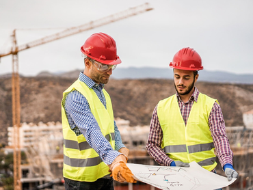 Men looking at blueprints