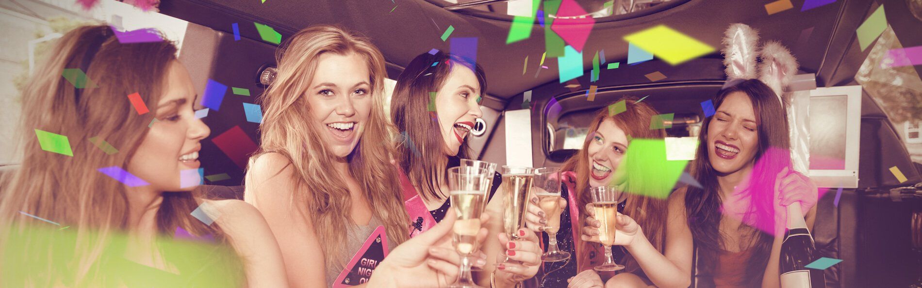 Bachelorette Party Limo Services Seattle A group of women are toasting with champagne glasses at a party.