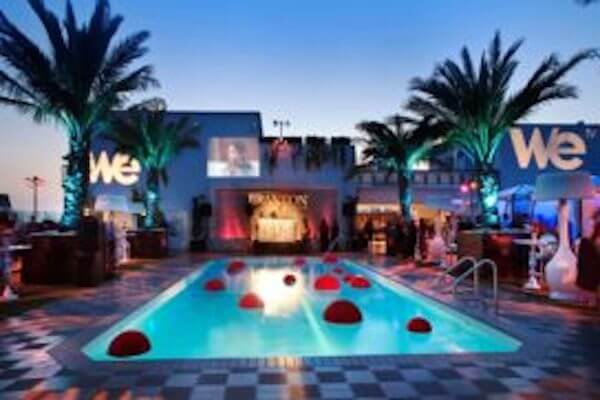 Limousine Company Near Me A large swimming pool in front of a building that says we