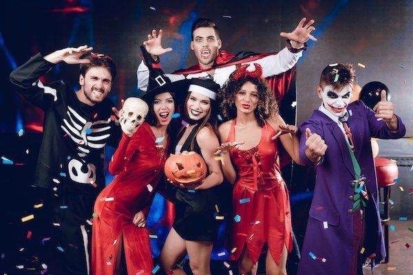 Halloween limo services in Seattle A group of people in halloween costumes are posing for a picture.