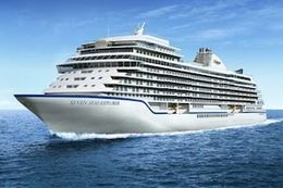 Cruise Limo Service A large cruise ship is floating on top of a body of water.