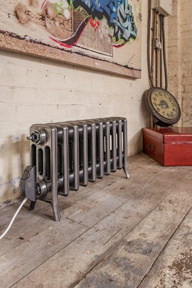 Forge electric cast iron radiator in lacquered bare metal Forge electric cast iron radiator in lacquered bare metal