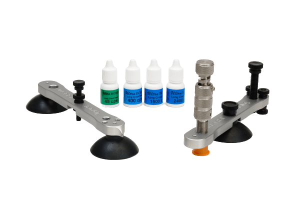 A set of tools and bottles on a white background.