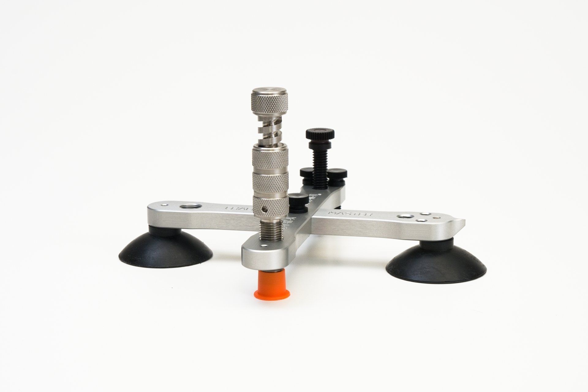 A tool that is sitting on a white surface.