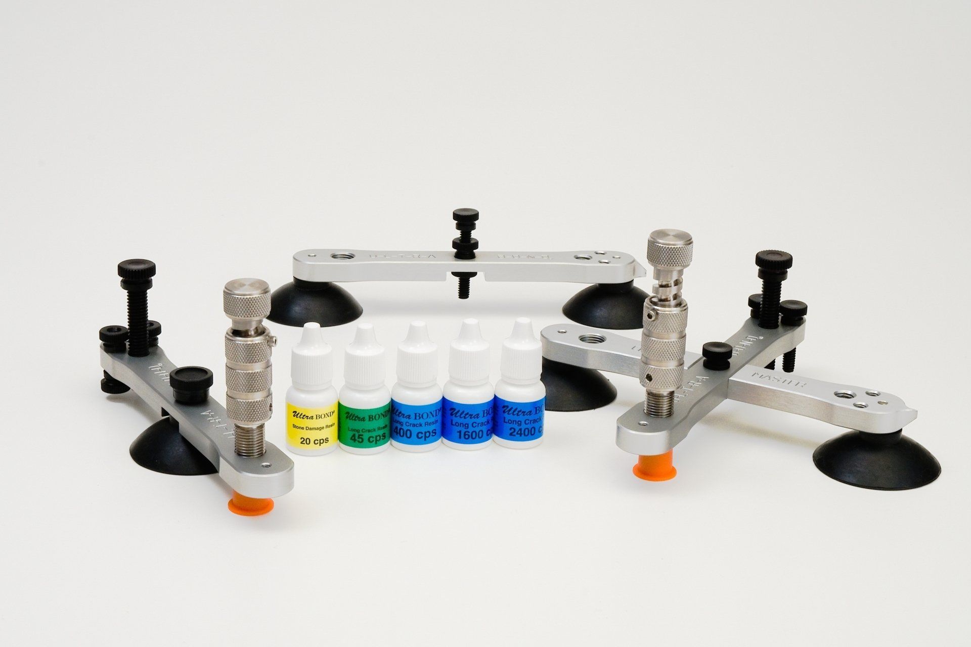 A bunch of bottles are sitting on top of a white surface.