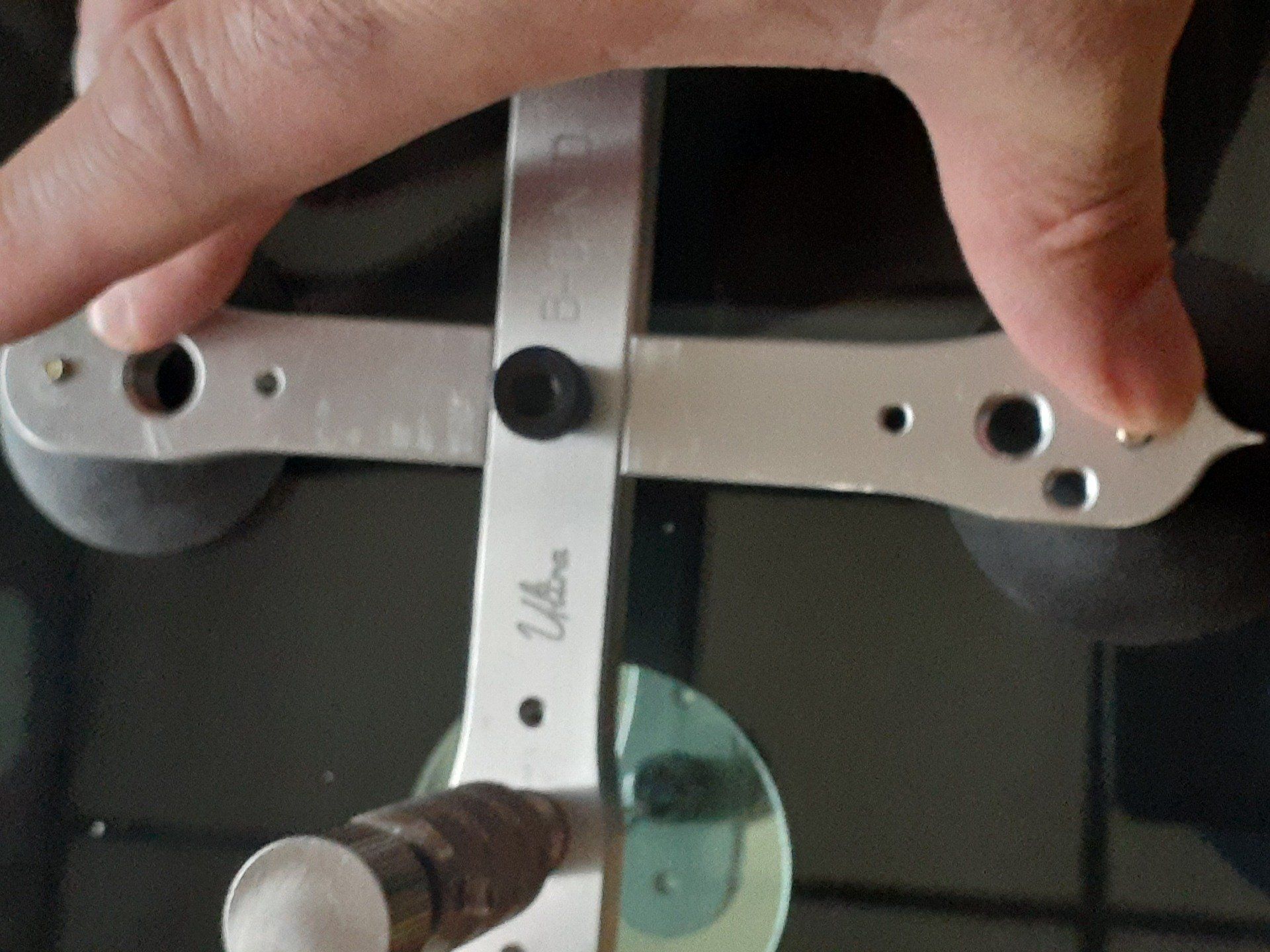 A person is holding a tool that says ulbe on it