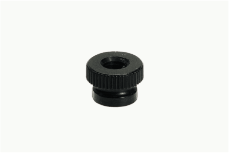 A black nut with a hole in the middle on a white background.