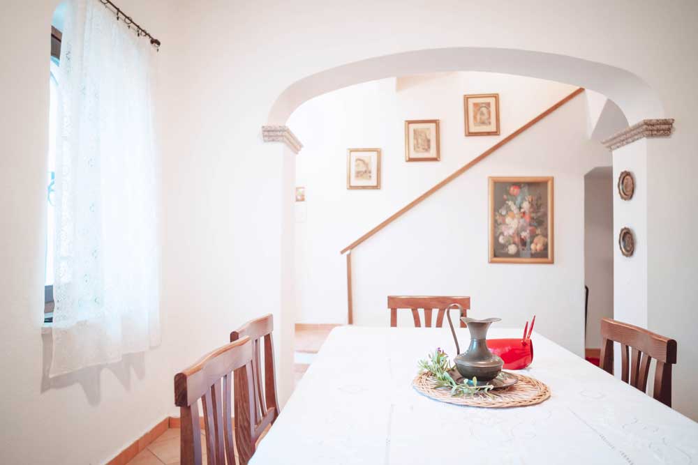 living room with interior masonry staircase