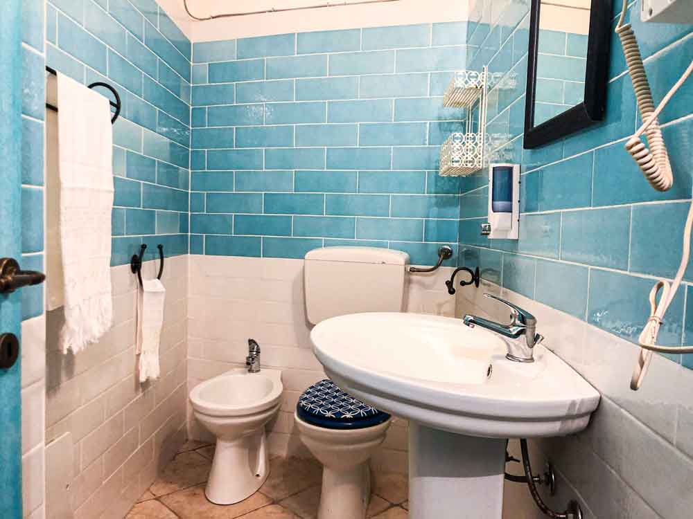 bathroom with turquoise shutters