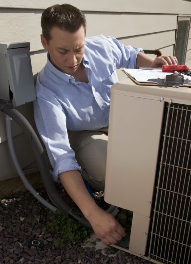 Man services air conditioning systems in Melbourne Man services air conditioning systems in Melbourne