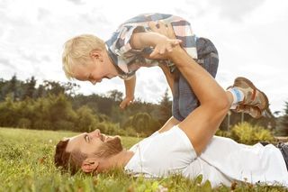 Father and son playing on the field — Child Support in Los Angeles, CA Father and son playing on the field — Child Support in Los Angeles, CA