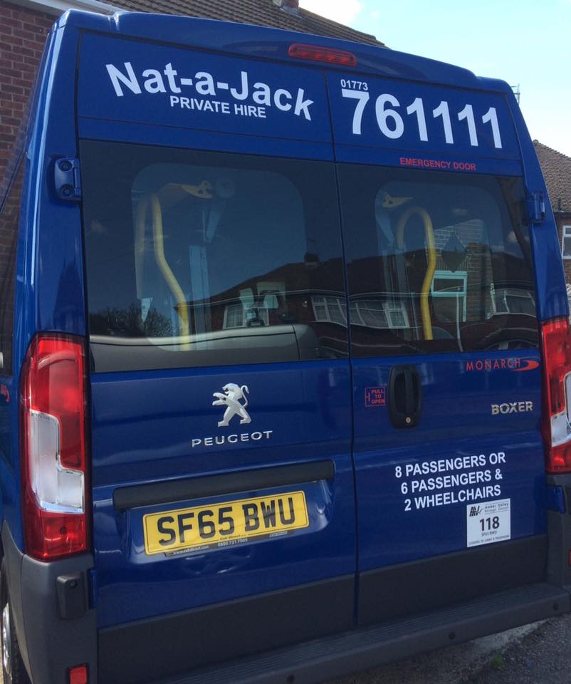 taxi mini bus with vehicle stickers applied