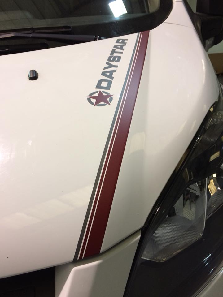 vehicle graphics on the bonnet of a white van