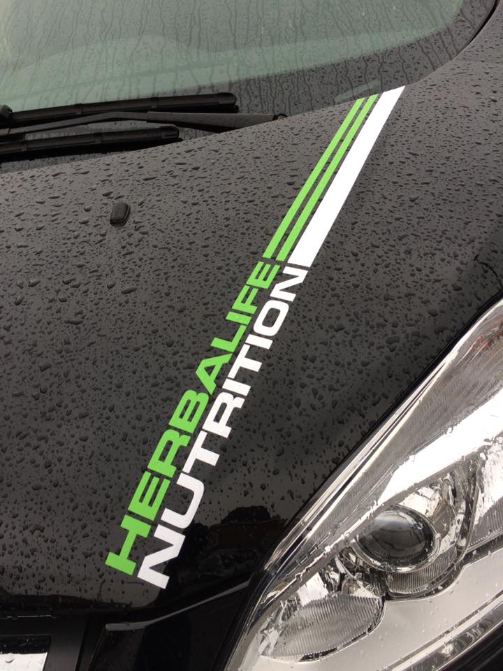 vehicle graphics on a white van