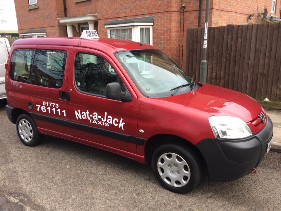taxi with vehicle stickers applied
