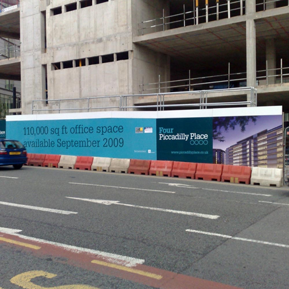 printed signs by a roadside advertising office space