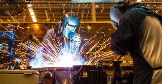 We are fully registered for absolute safety. Call on 01737 302097 A welder at work.