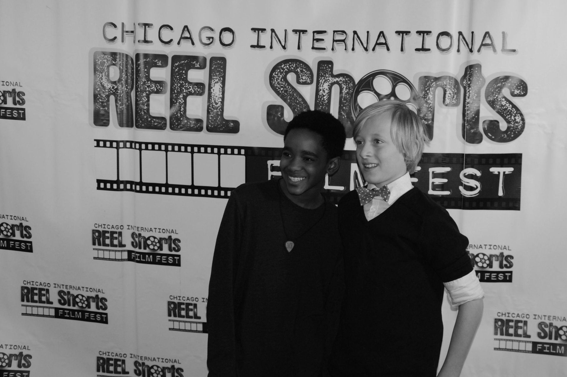 Two people smiling, posing at the Chicago International Reel Shorts FilmFest.