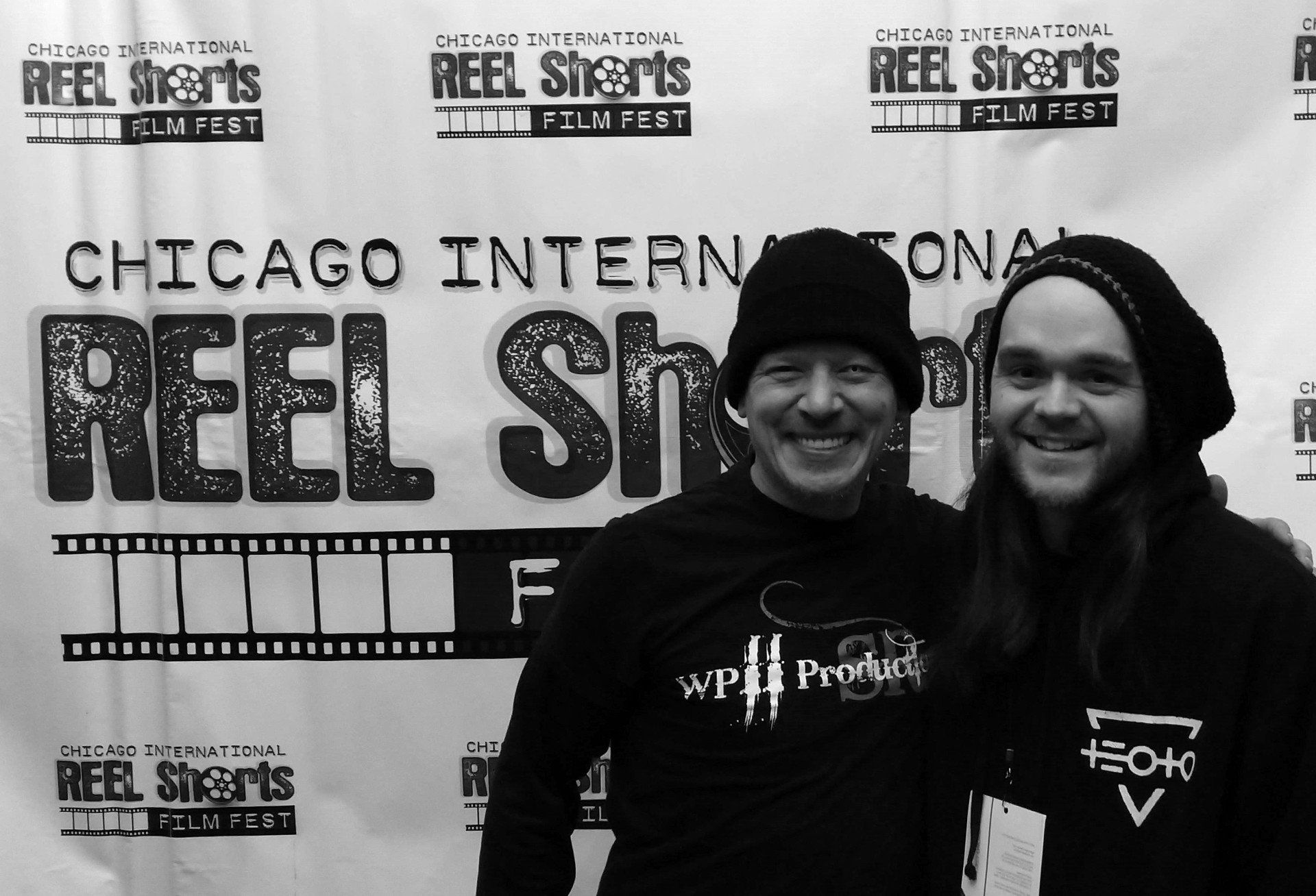 Two men smiling at the Chicago Reel Shorts Film Fest.