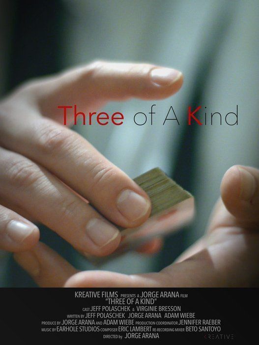 Hands holding playing cards, title 