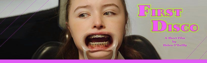 Young woman at dentist with mouth retractor, text