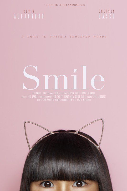 Pink poster with woman's eyes and headband that forms cat ears, text
