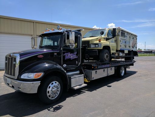 Red warning triangle — Larry Menz Towing Services Inc in Bourbannais, IL