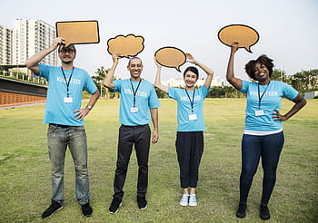 non profit organization with signs above heads