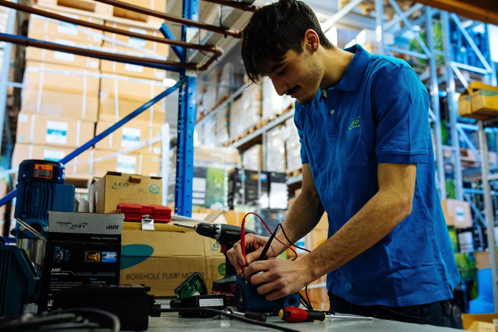 workman repairing a water pump
