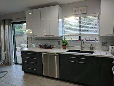 kitchen with white counter tops with view of outside
