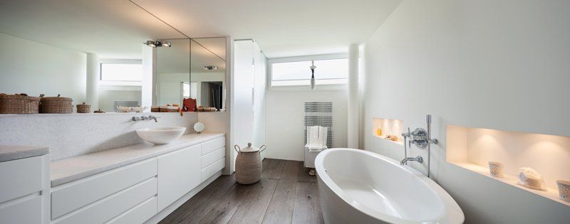 bathroom with tub and extruded sink in counter