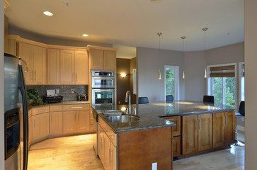 wood and granite counter top kitchen with island
