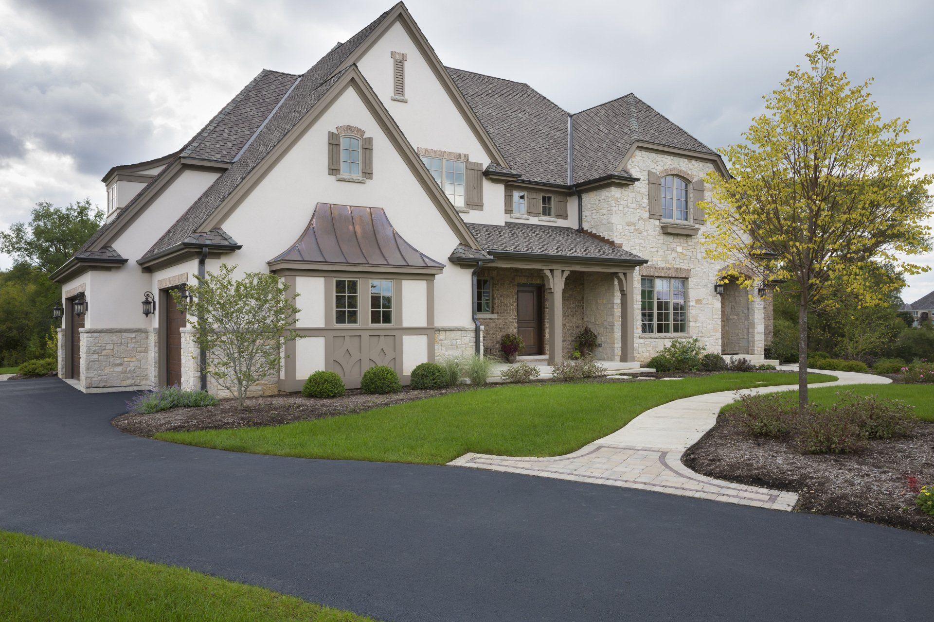 A large house with a driveway leading to it
