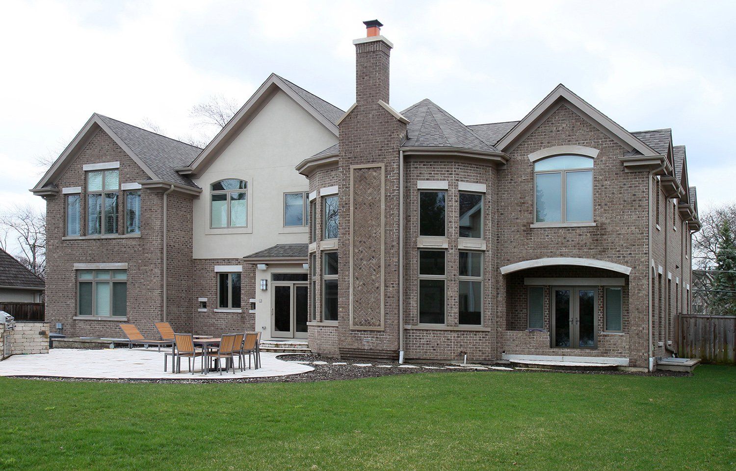 A large brick house with a lot of windows