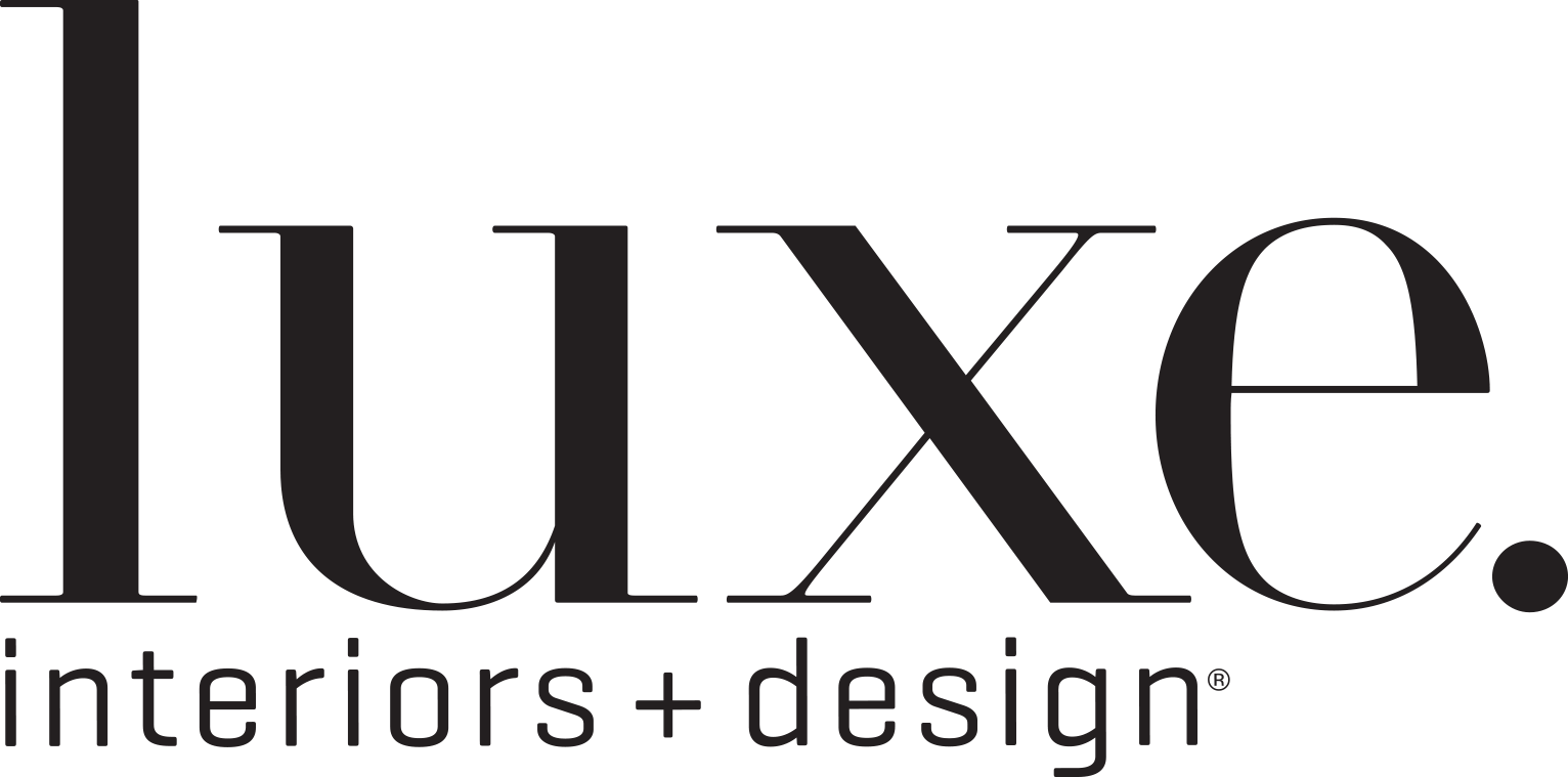 The logo for luxe interiors + design is black and white.