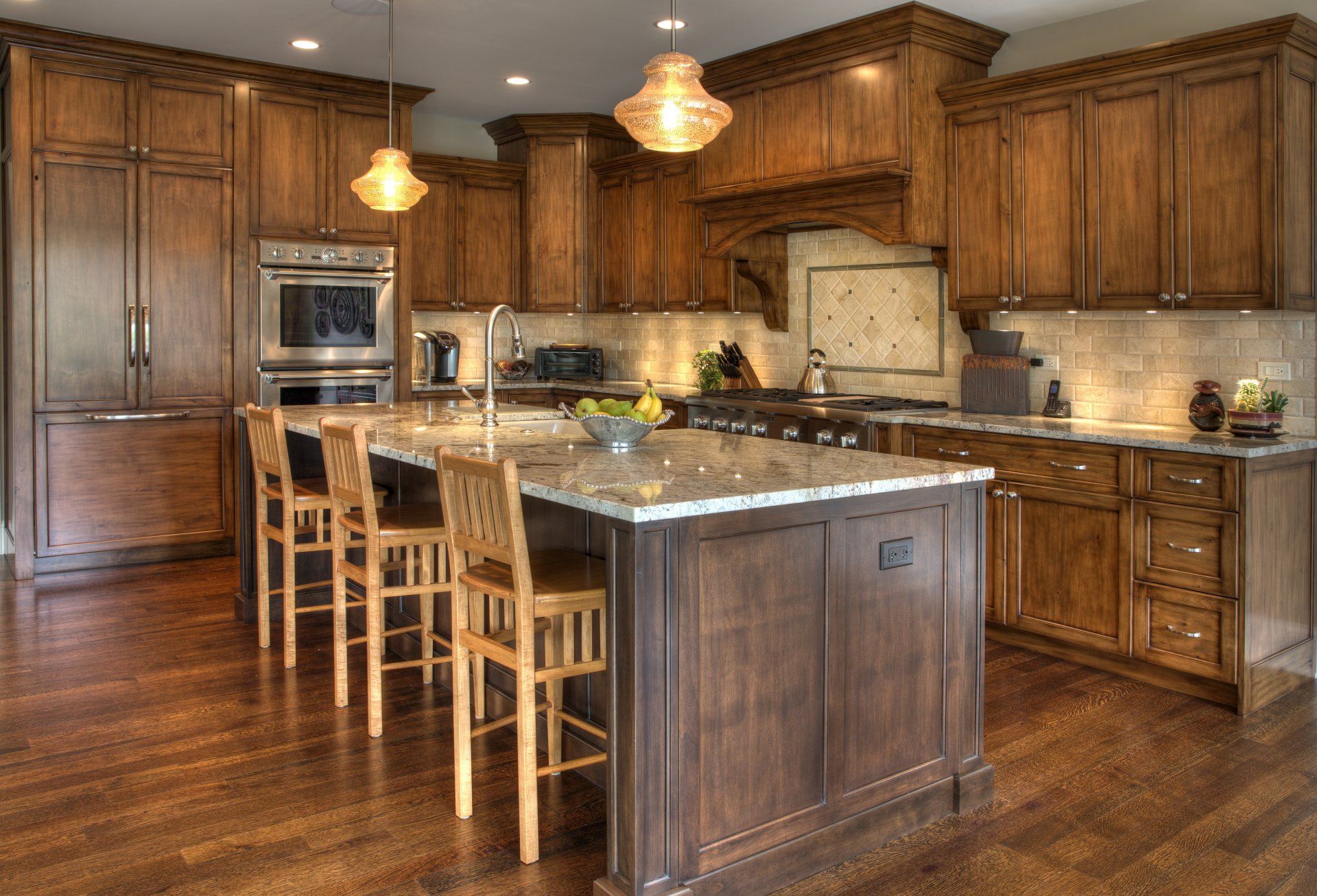 A large kitchen with wooden cabinets and a large island