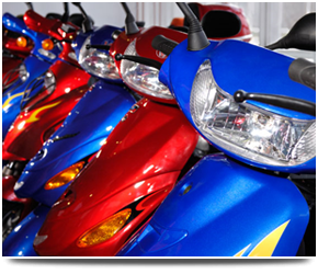 When you want to keep your bike in great shape in Hearne Bay call Hearne Bay Motorcycles Blue and red scooters