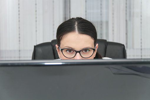 Application Form—Young businesswoman sitting at desk and working in Lancaster, PA