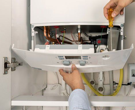 Fixing Water Heater — Martinez, CA — Ernie’s Plumbing & Sewer Service Fixing Water Heater — Martinez, CA — Ernie’s Plumbing & Sewer Service