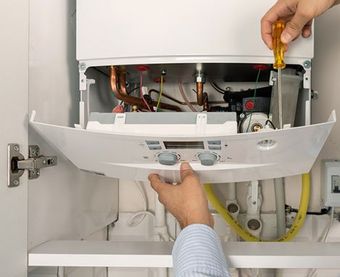 Fixing Water Heater — Martinez, CA — Ernie’s Plumbing & Sewer Service Fixing Water Heater — Martinez, CA — Ernie’s Plumbing & Sewer Service